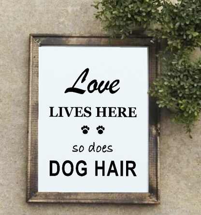 Love Lives Here So Does Dog Hair framed canvas sign styled with greenery