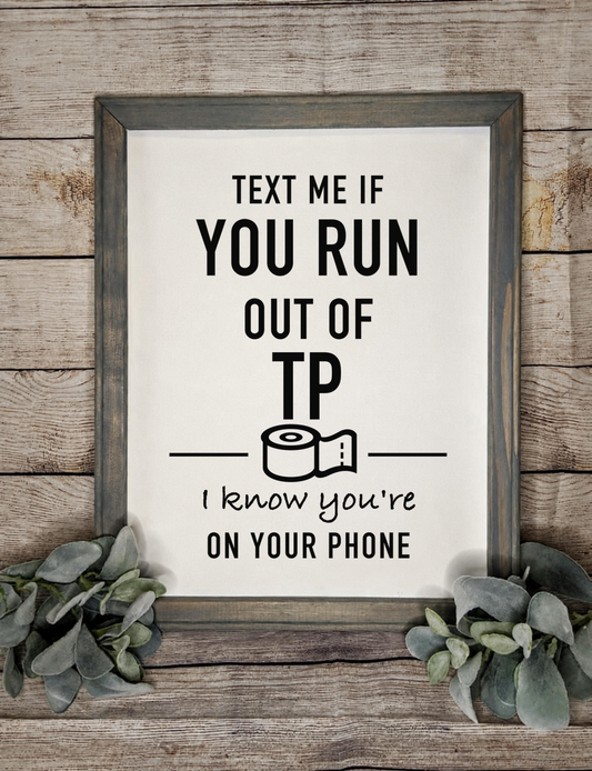 Text Me If You Run Out of TP framed canvas sign in a Smoke Gray wood frame with eucalyptus